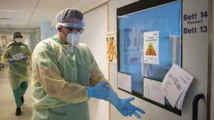 Merkel verteidigt Notbremse als "dringend nötig"