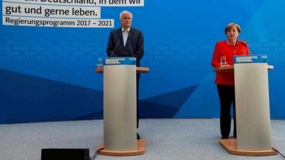 Merkel und Seehofer werben mit Steuersenkungen um W