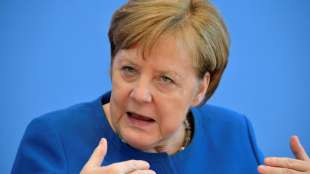 Merkel und Ministerpräsidenten beraten über Coronakrise und Energie