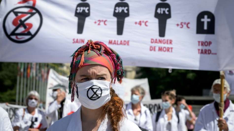 Gesundheitspersonal fordert am WHO-Sitz energischeres Vorgehen gegen Klimawandel