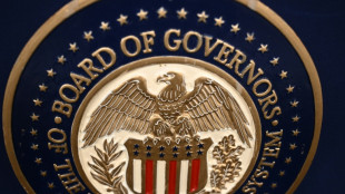 Gold hits record, stocks mixed as Trump fuels Fed fears