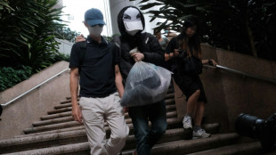 Hong Kong convicts father of wanted activist over handling of funds
