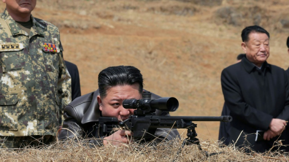 North Korea's Kim fires new sniper rifle while visiting troops