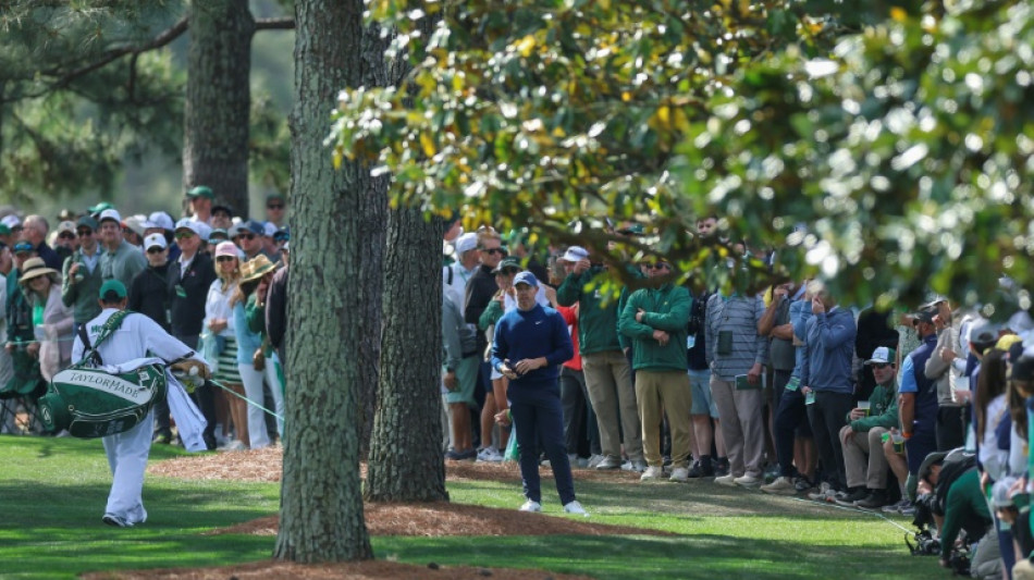  'Scrappy' McIlroy leans on experience for share of Masters lead 