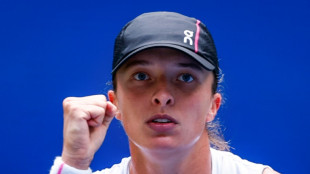 Swiatek labours into US Open third round