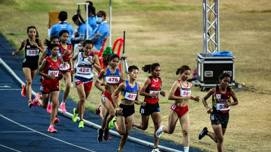 Soaked Cambodian runner gets $10,000 bonus from PM
