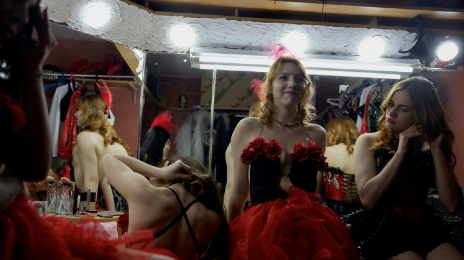 In a Ukrainian strip club, the war is laid bare 