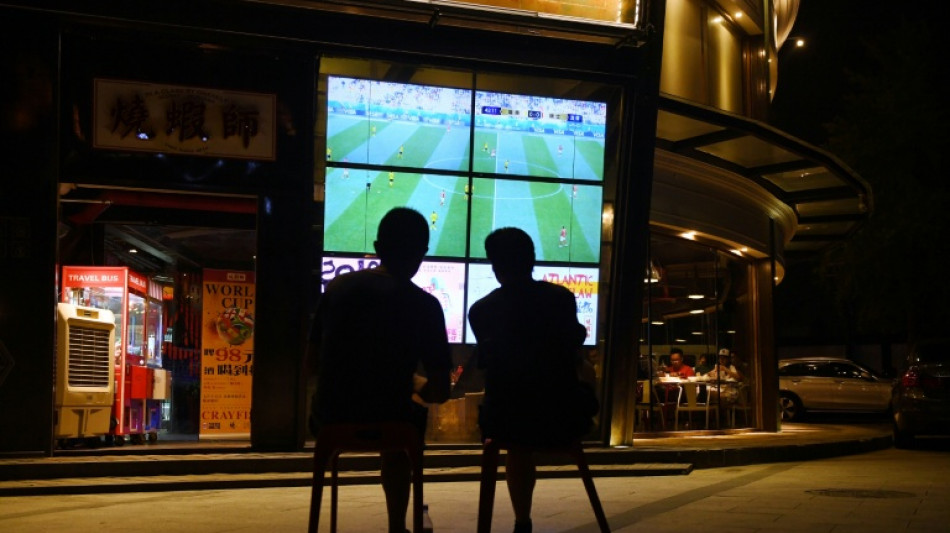  Asia football fans sweat on broadcast rights as World Cup nears 