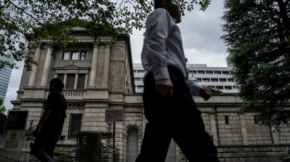  Most Asian stocks track Wall St rally, yen drops after BoJ rate hike 