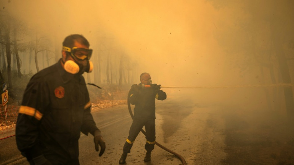  Helicopters collide in Greece as fires spread 