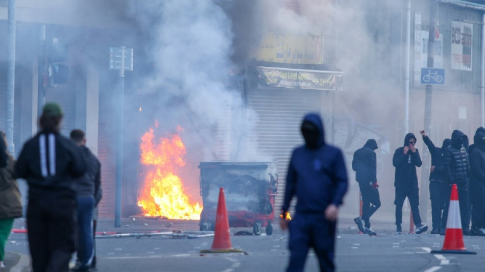  Protesters torch buildings and vehicles, block roads over Belfast stabbing 