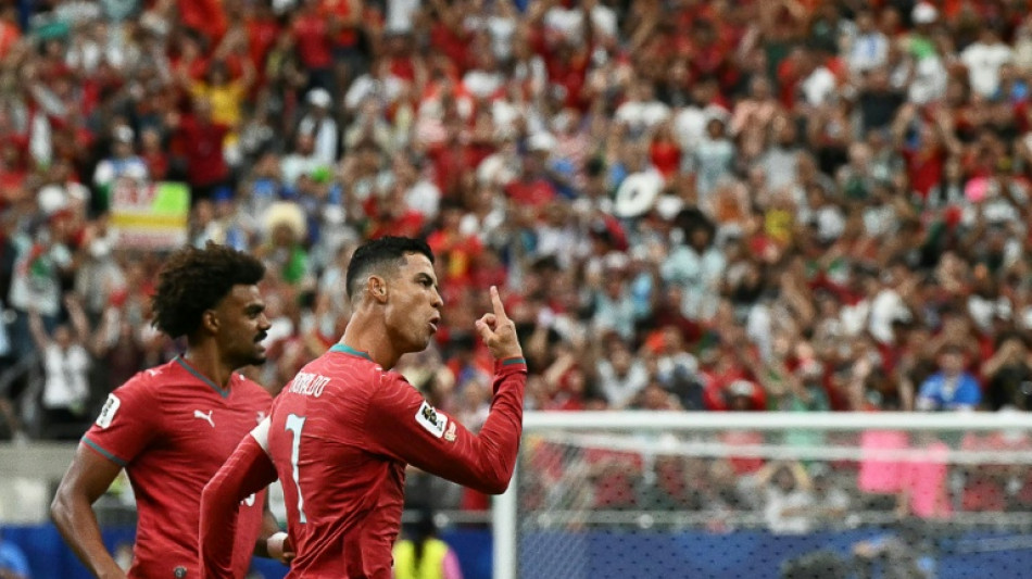  Ronaldo delights in silencing 'attacks' after making World Cup history 
