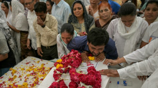 Relatives wait for remains after Air India crash
