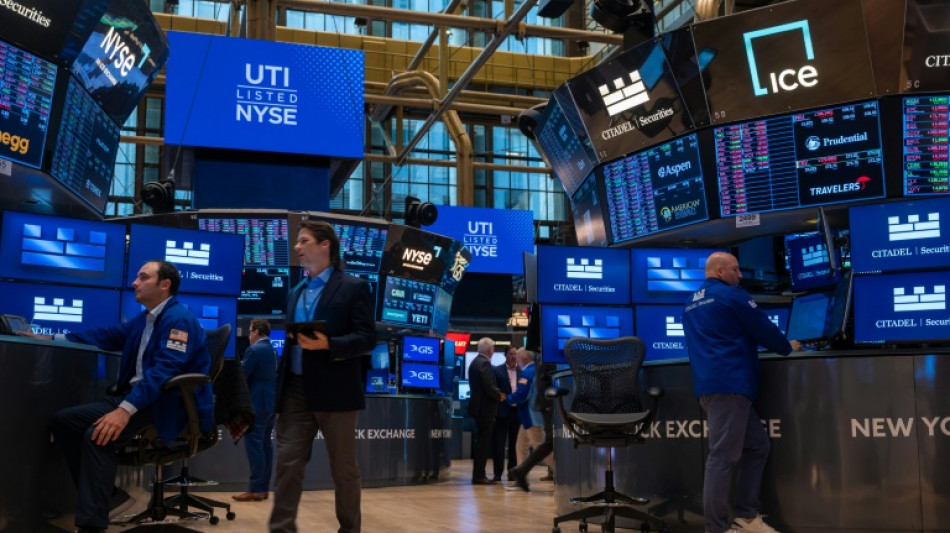 US stocks edge higher while dollar dips after Moody's downgrade