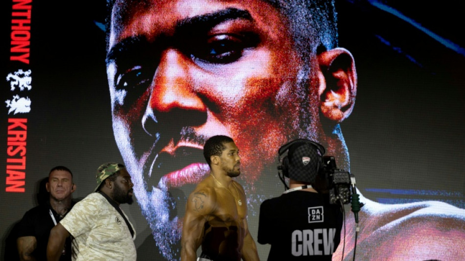  Joshua survives knockdowns, stops Prenga 