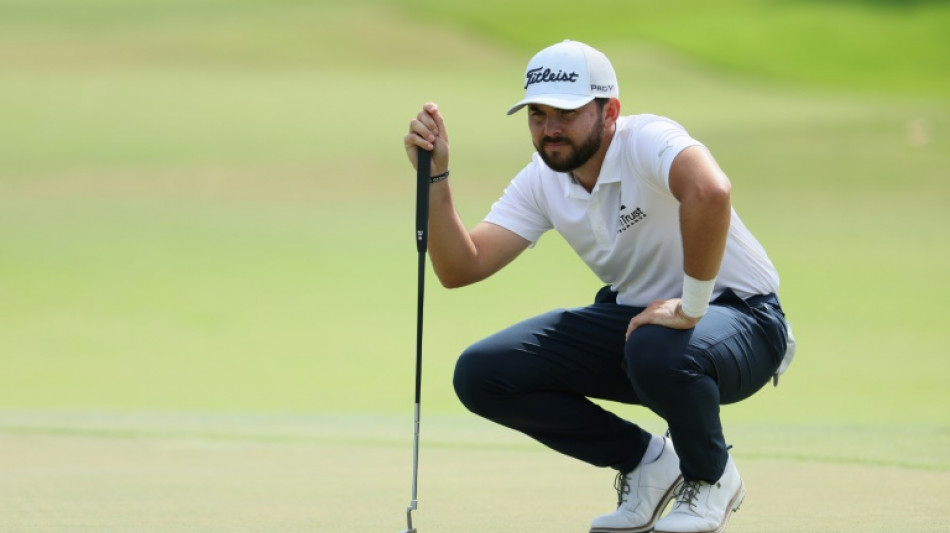 Two eagles lift Buckley to Sony Open lead