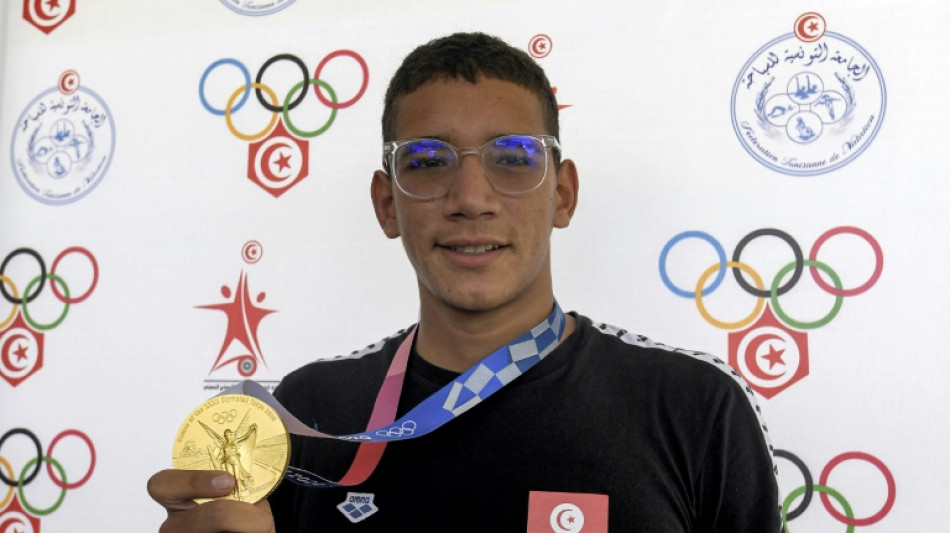 Nadador tunisiano Hafnaoui, ouro ol&iacute;mpico em 2021, &eacute; suspenso por 21 meses