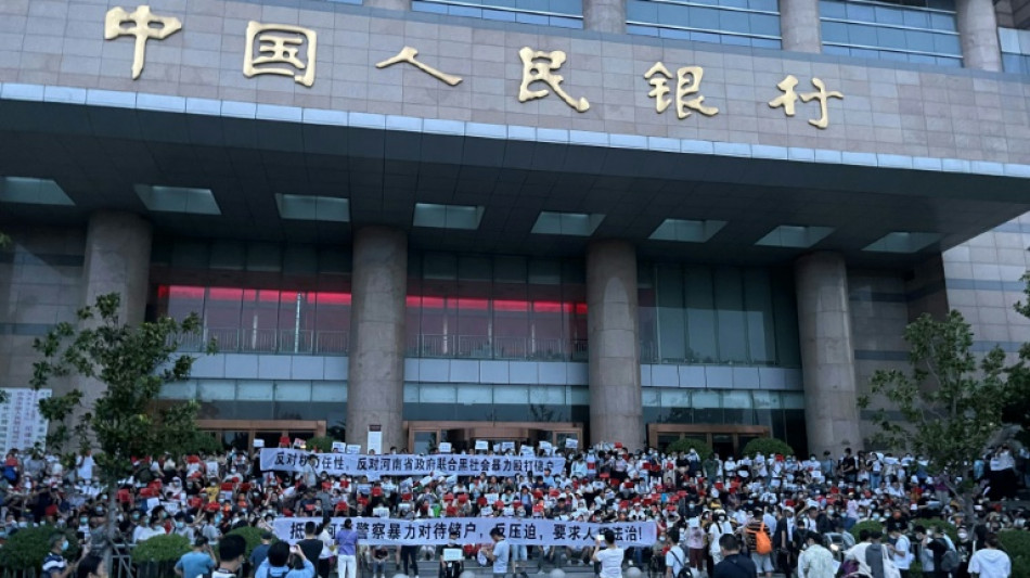 China detains alleged bank fraud 'gang' after rare mass protests