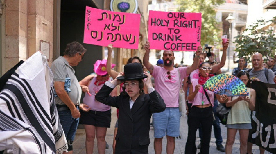  Cafe at centre of Israel culture clash agrees to shut on Sabbath 
