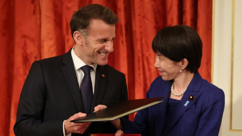  Macron lauds Europe's 'predictability' in seeming contrast to Trump 