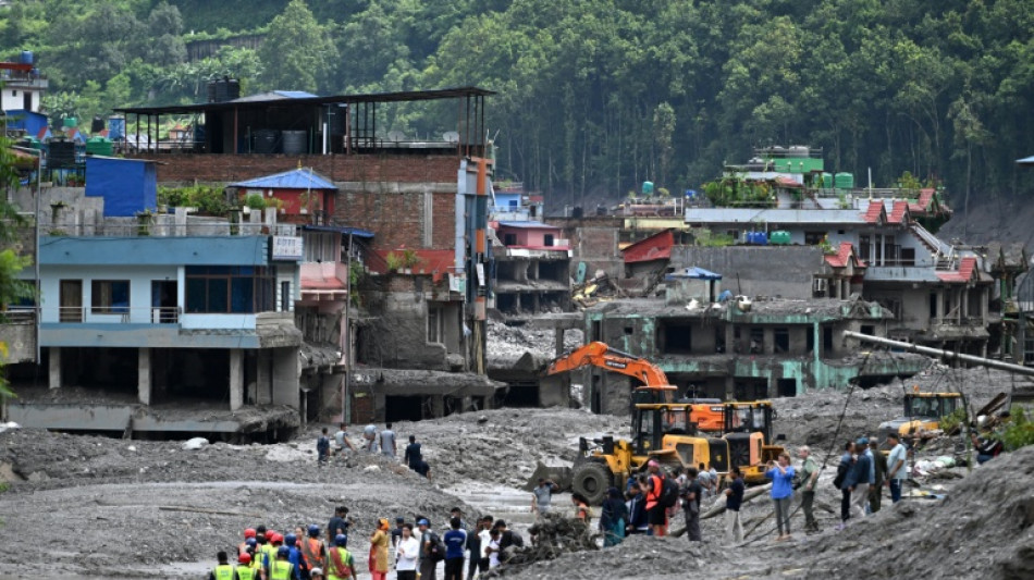  Nepal flood survivors return to ruins to salvage memories 