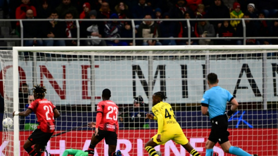 Dortmund see off Milan to reach Champions League knockouts