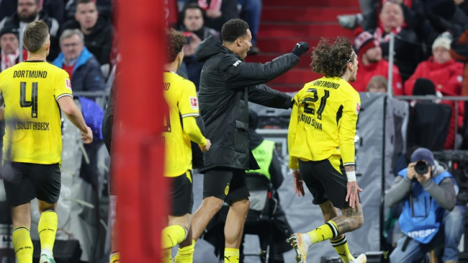  Kane misses penalty as Bayern held by Dortmund 